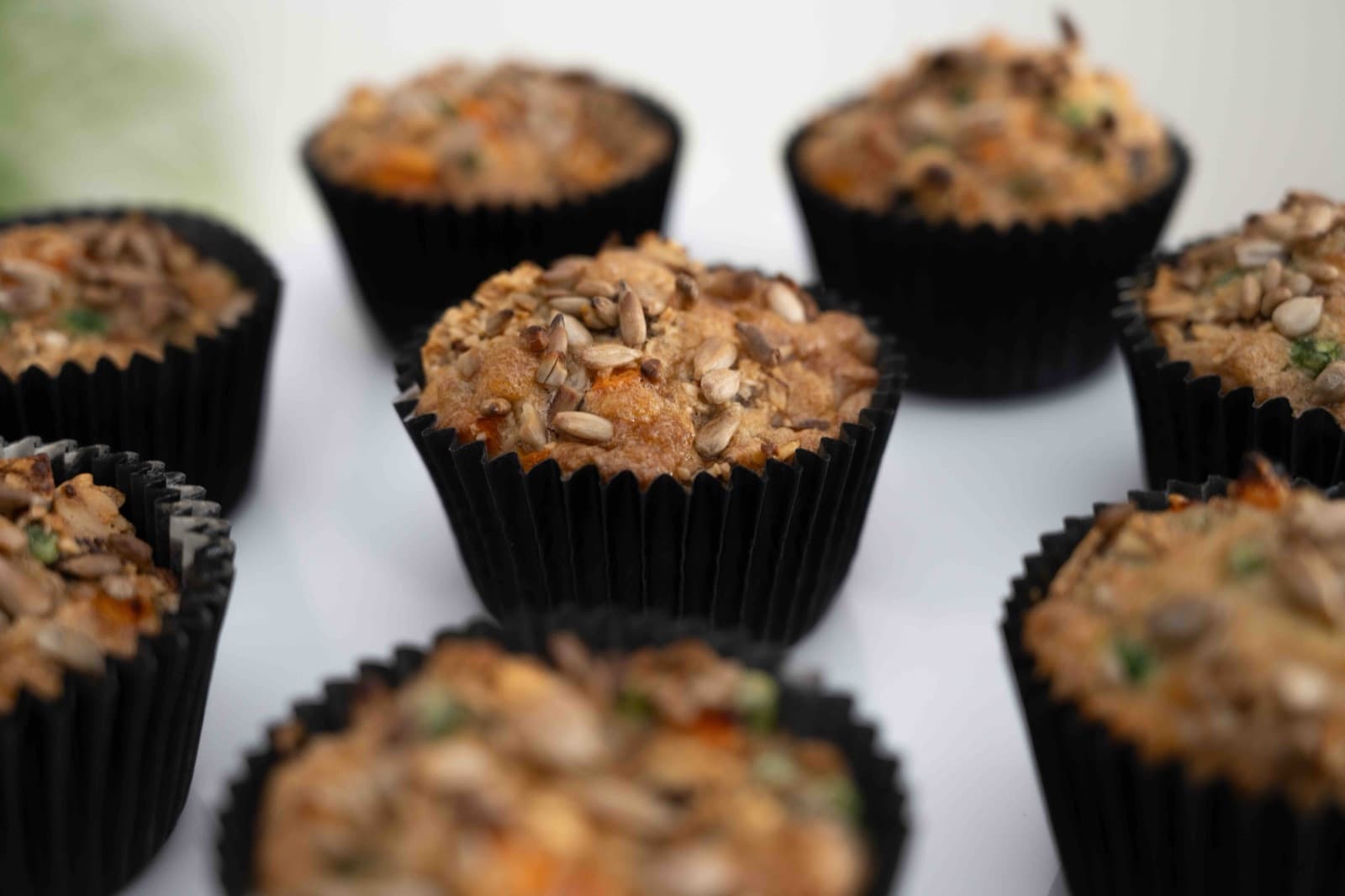 Muffins topped with nuts and seeds
